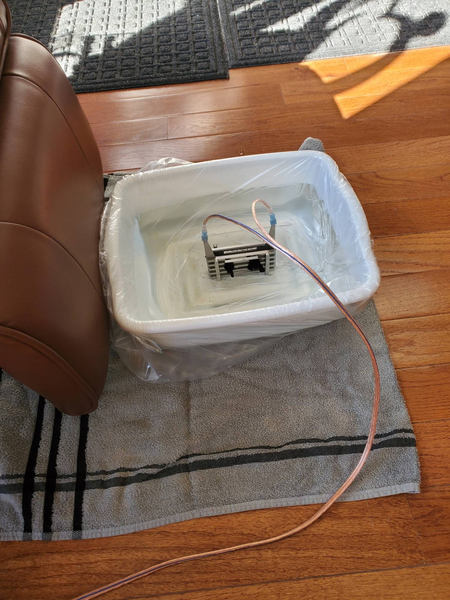 The ionic foot bath at fhL Massage & Wellness, set up beside a spa chair