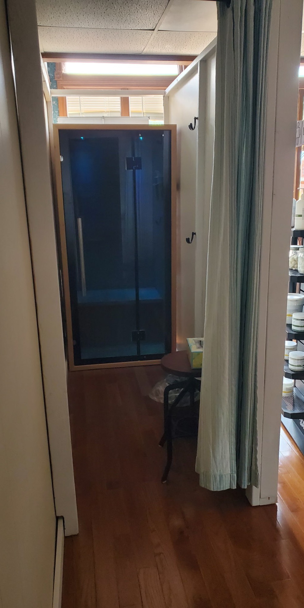 The private glass-door salt booth at fhL Massage & Wellness